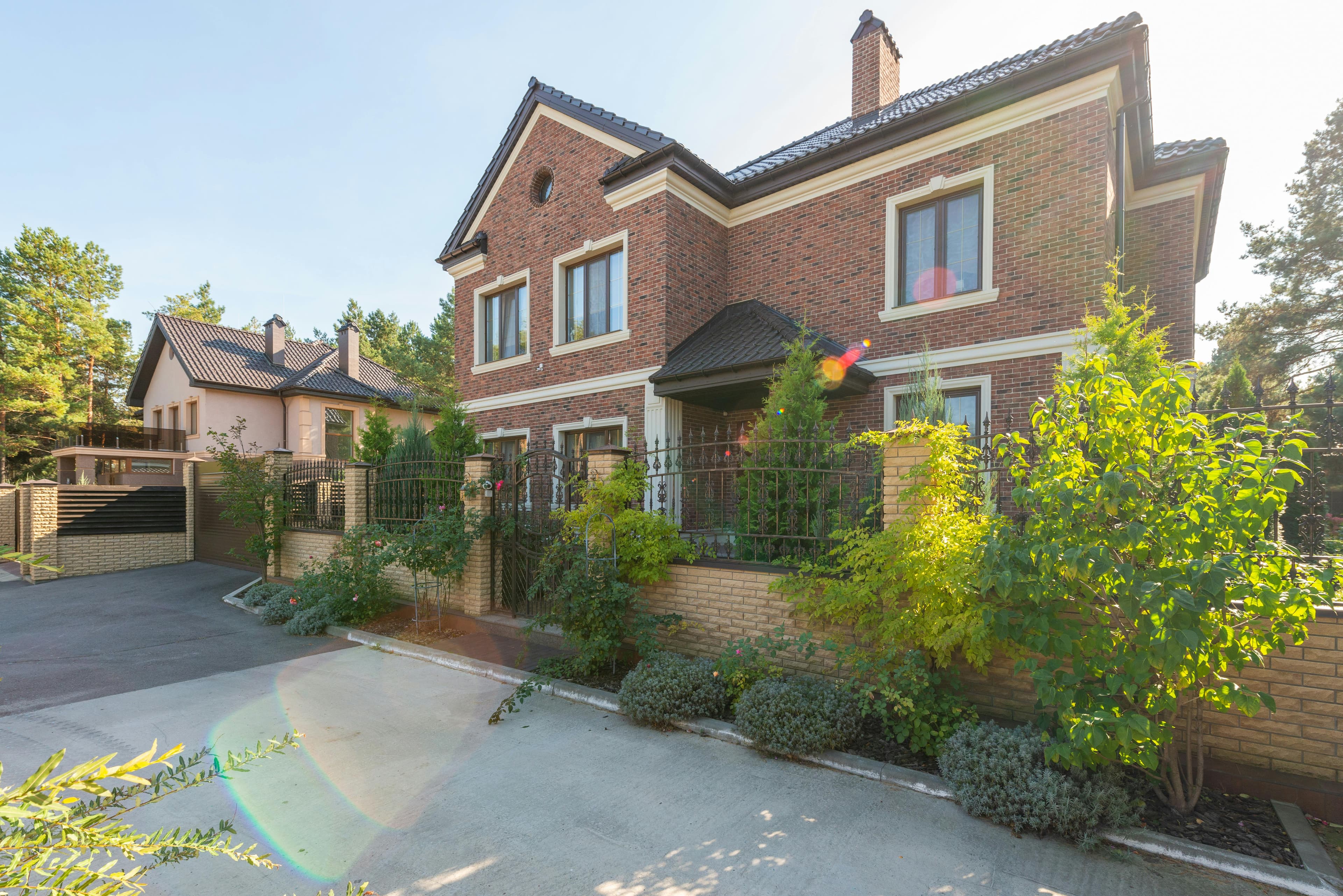 Suburban brick home with garden and driveway